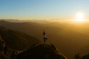 People doing yoga in sunset